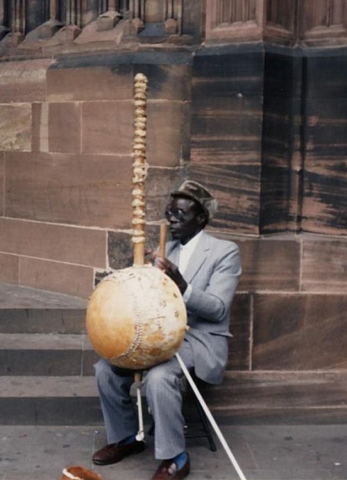 African kora player busking in the doorway of Strasbourg Cathedral - 23.10.94