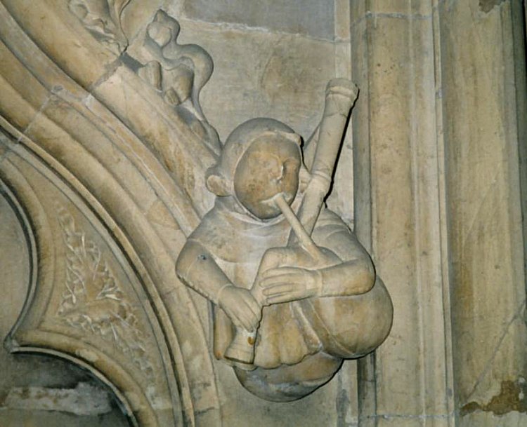 Carving of a bagpiper