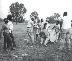 Mississippi Hill Country showing Napoleon Strickland on fife, Jimmy Buford on bass, drum, R L Boyce on snare drum and Othar Turner dancing
