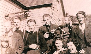 The MacDonald family in 1942. Lila MacIsaac in lower right; John holds the fiddle