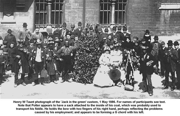 Henry W Taunt photograph of the 'Jack in the green' custom, 1 May 1886. For names of participants see text. Note that Potter appears to have a sack attached to the inside of his coat, which was probably used to transport his fiddle. He holds the bow with two fingers of his right hand, perhaps reflecting the problems caused by his employment; and appears to be forming a G chord with his left.