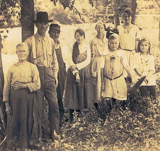Left to right: Anna Eliza Chandley, Howard Chandley (husband), John Roberts, Milam Chandley (daughter), Mattie Gross, Mammie Gross, Talles Chandley (daughter), Mildred Chandley (daughter).